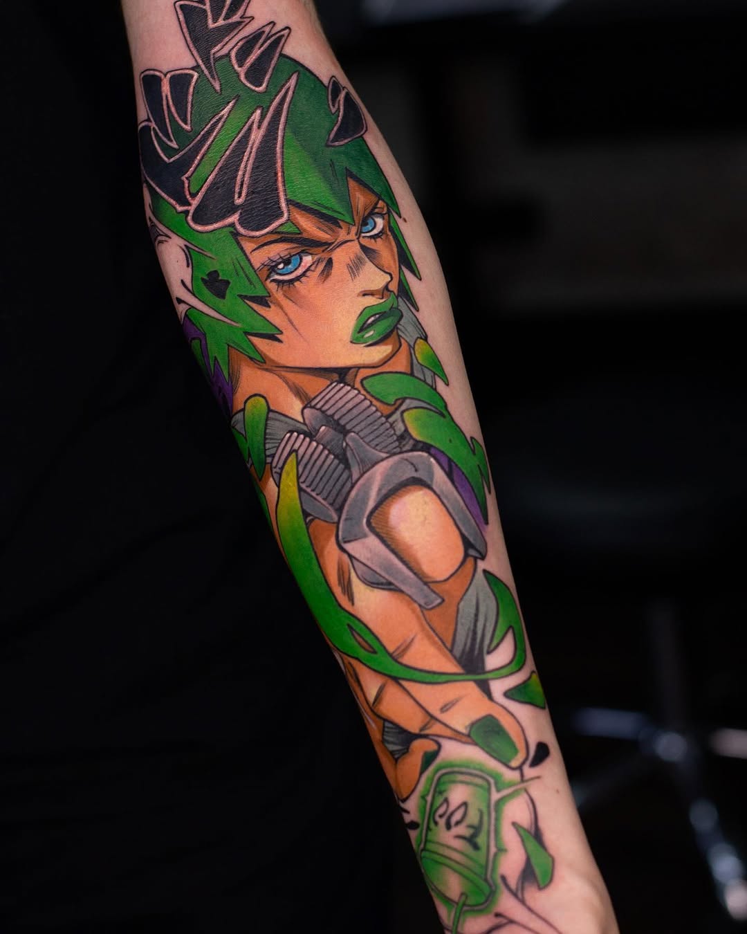 Colorful tattoo on an arm featuring an orange-skinned character with green spiky hair, blue eyes, and purple armor, surrounded by green leaf designs.