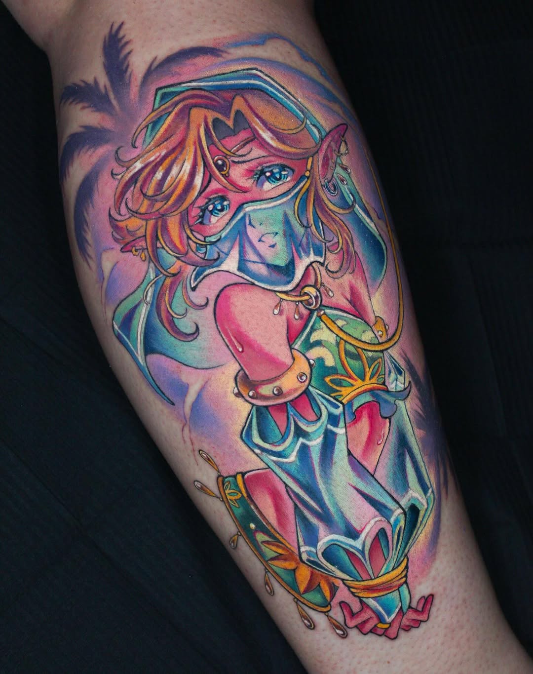 Colorful tattoo on a calf featuring a female character with orange wavy hair, blue eyes, and ornate armor in pink, blue, gold, and teal tones.