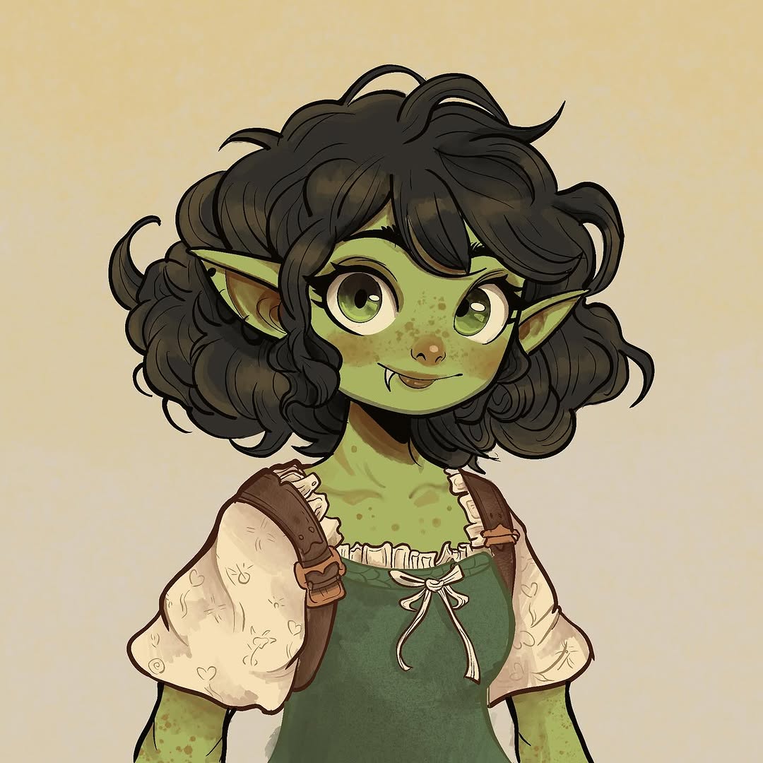Cartoon character with green skin, pointed ears, black curly hair, and freckles wearing a green dress with brown and cream accents.