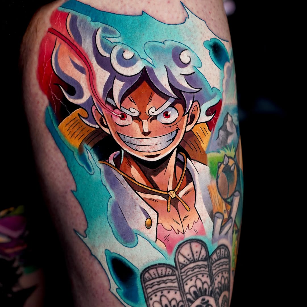 Colorful shoulder tattoo featuring a smiling character with purple hair, orange clothing, and dynamic swirling background in teal, red, and orange tones.
