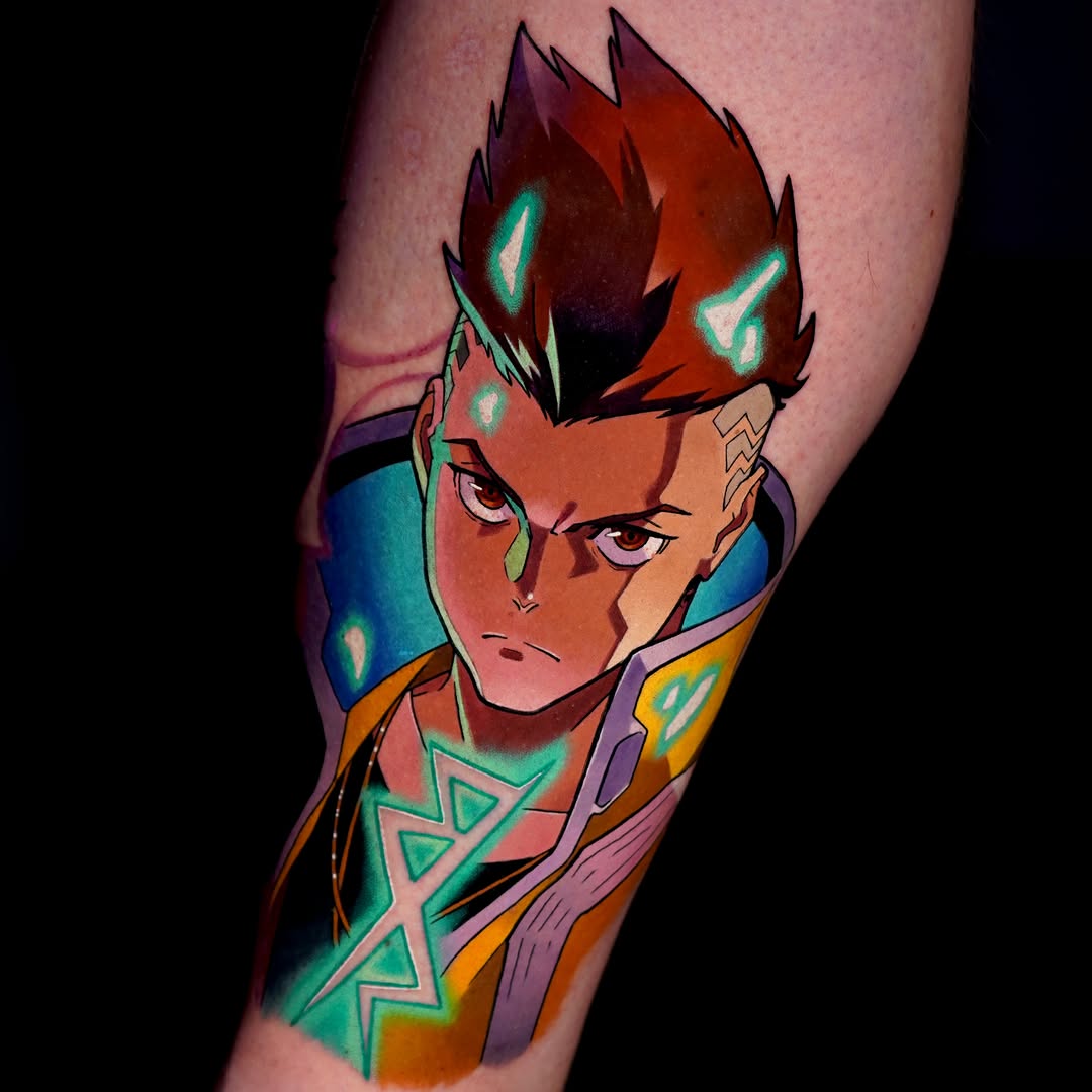 Colorful tattoo on a calf featuring a red-haired character with glowing green eyes, wearing purple and orange clothing with geometric patterns.