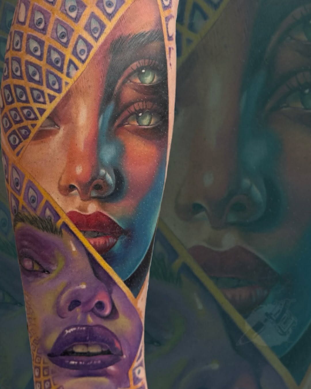 Colorful portrait tattoo on arm featuring a woman's face with striking green eyes, geometric patterned headwrap in gold and purple, vibrant gradient background.