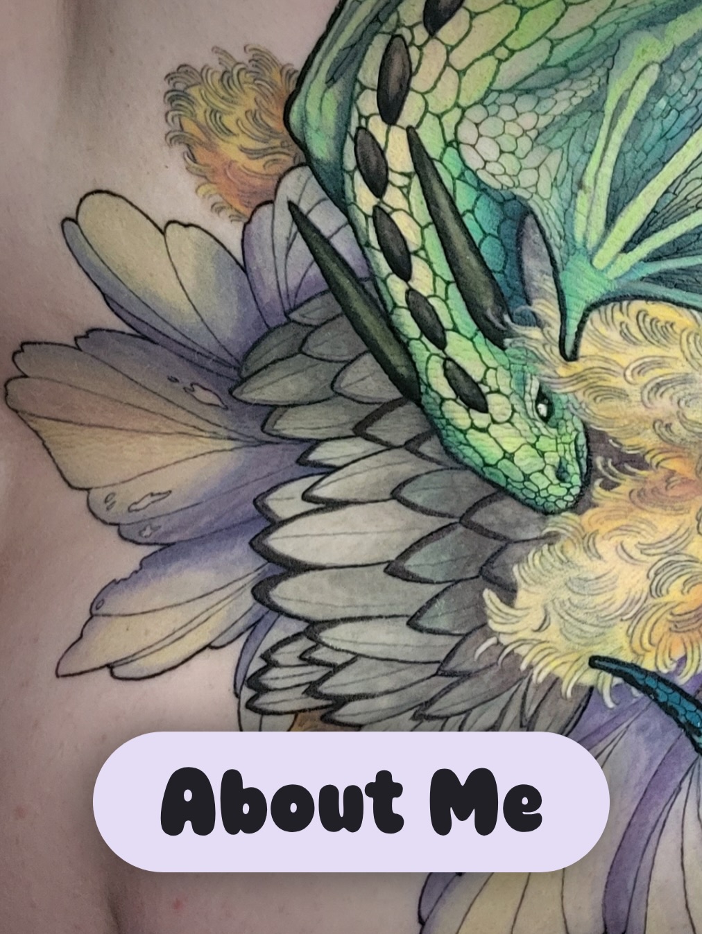 Colorful dragon head tattoo with green scales, gold and purple mane, and detailed wing feathers in yellow, green, and lavender tones.