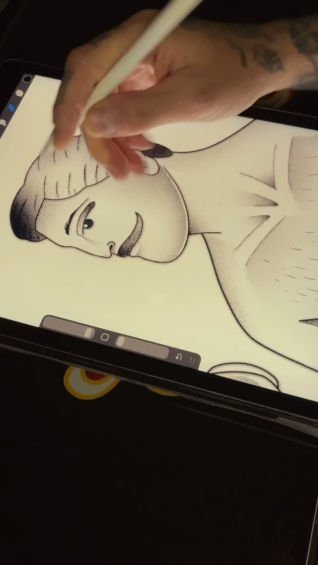 Artist's hand using stylus on tablet displaying a line-drawn portrait of a person's face with shaded features and expressive eyes.