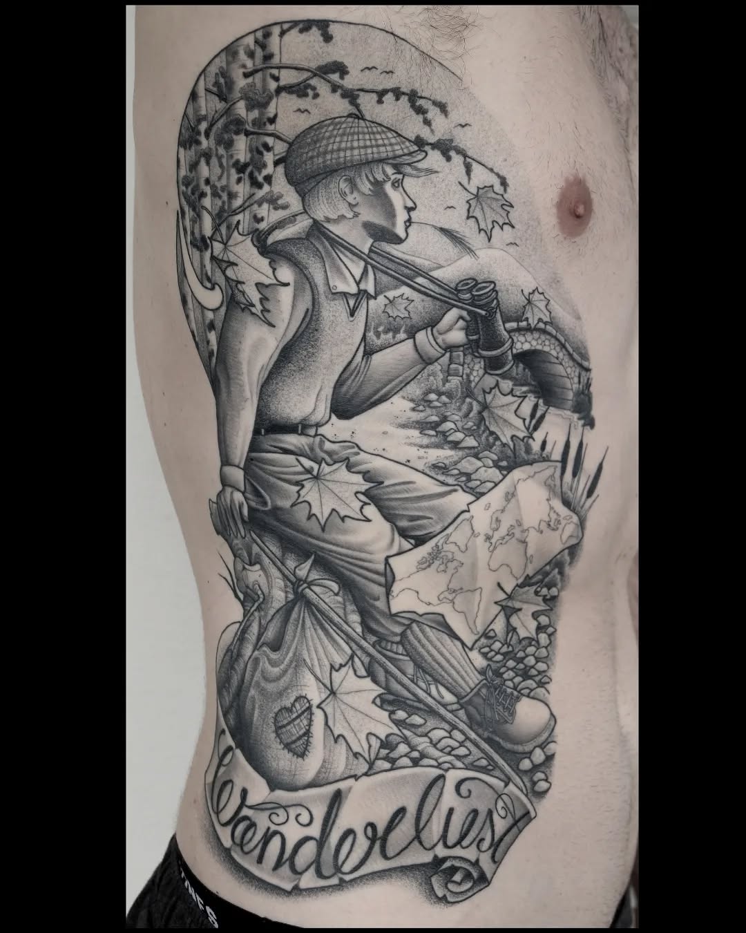 Monochrome shoulder tattoo depicting a hunter in a cap holding a rifle with autumn leaves, forest scenery, and "wanderlust" text below.