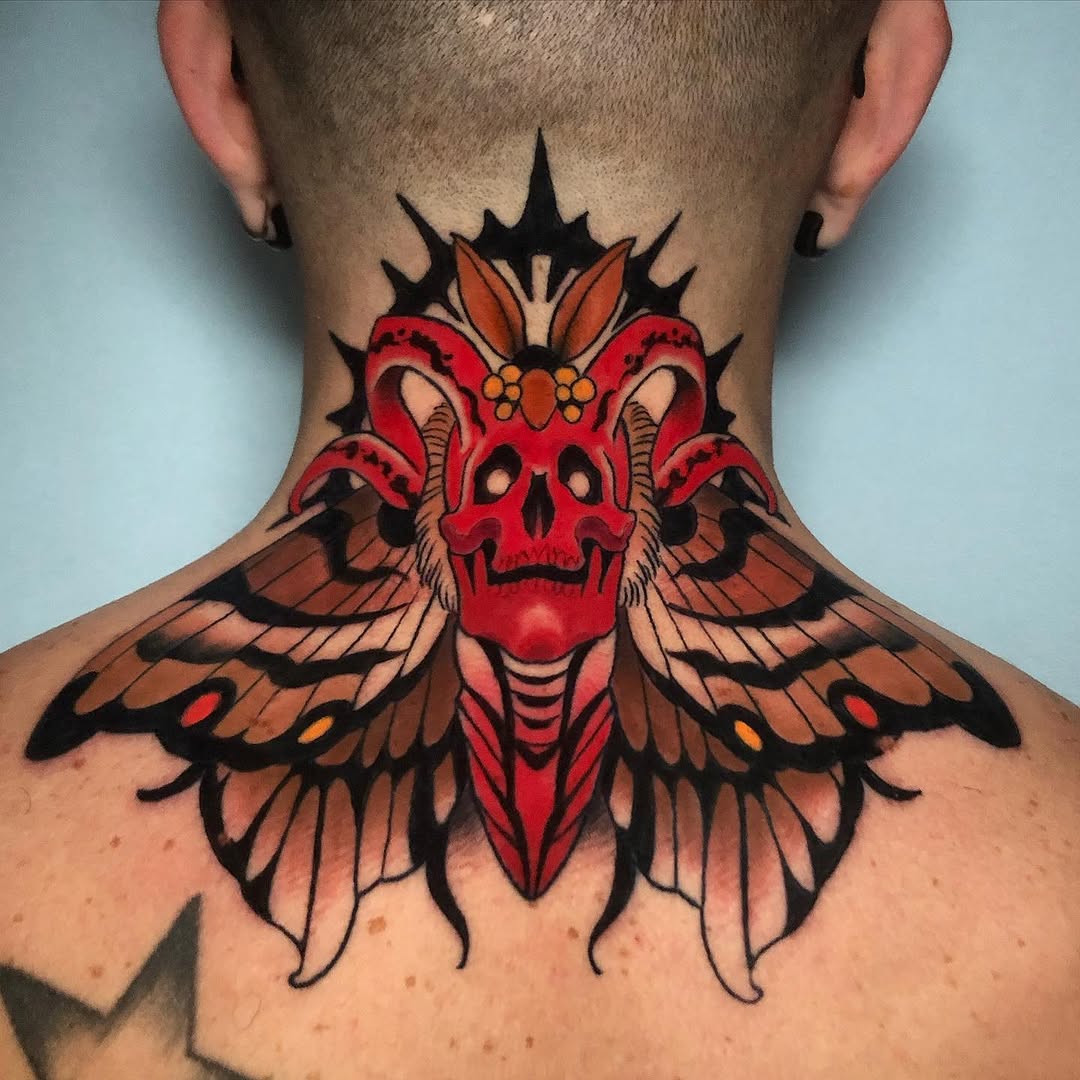 Red demon skull with orange wings and black spikes spans the back of the neck and upper shoulders in bold colors.