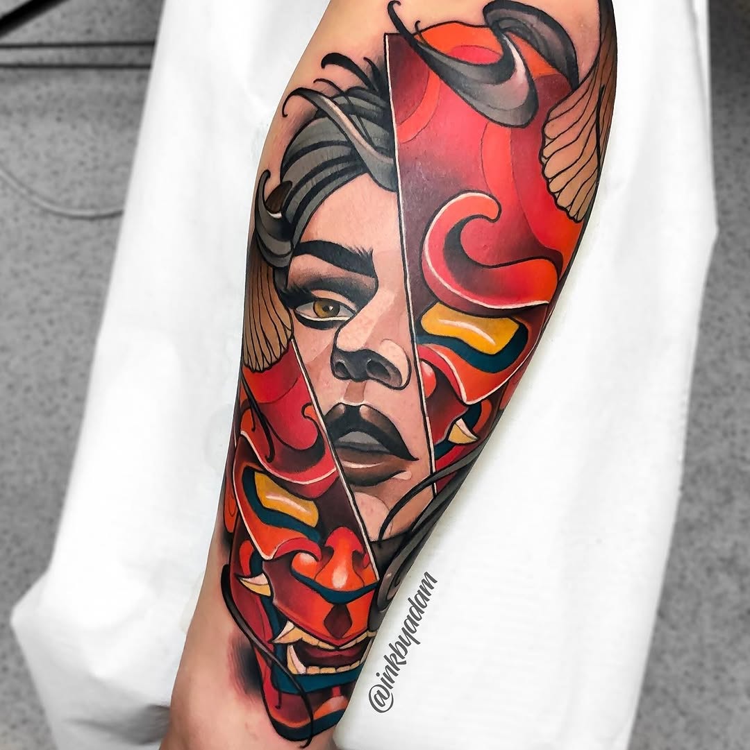 Colorful portrait tattoo on forearm featuring a woman's face with dramatic makeup, split design with red floral motifs, gold and blue accents.