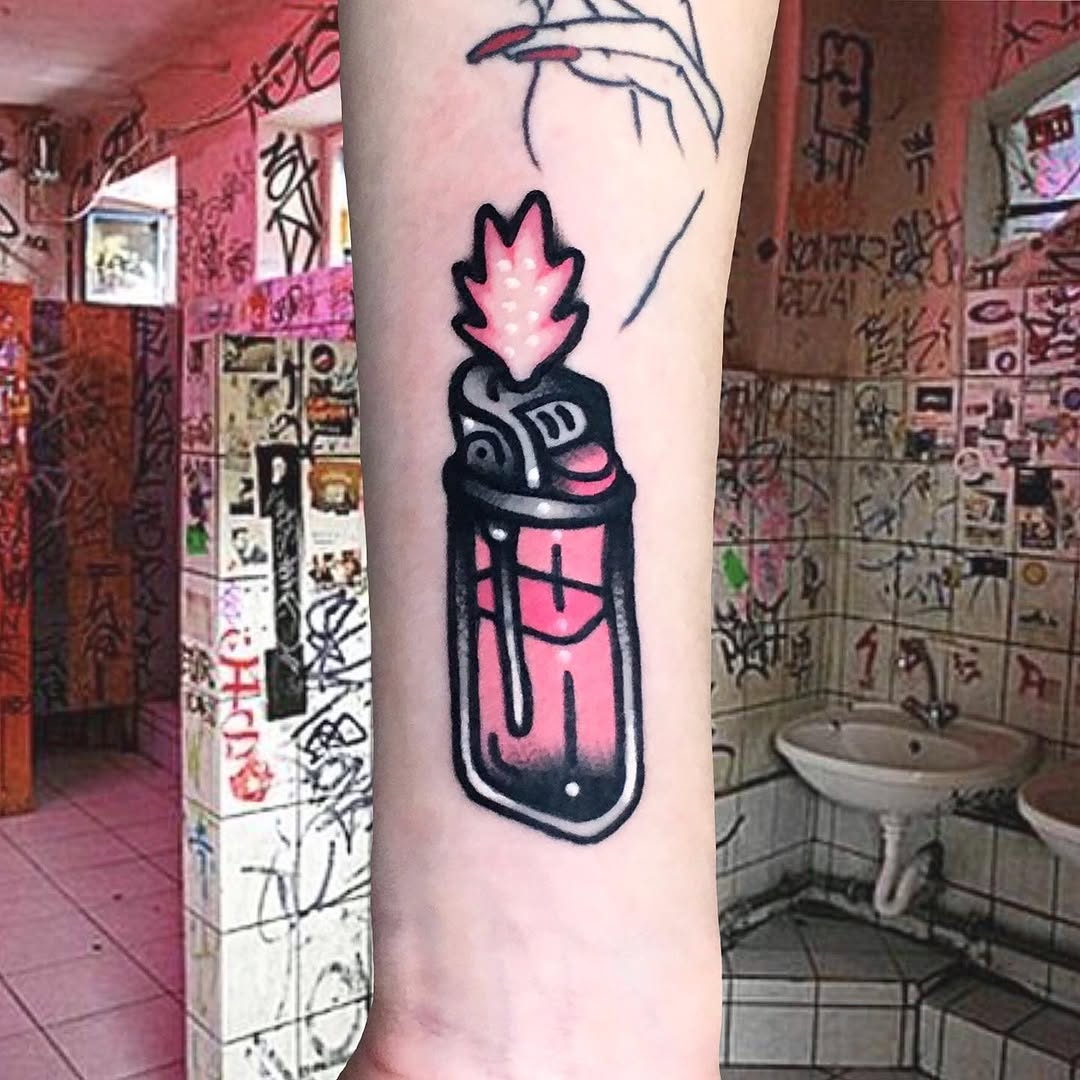 Bright pink and black spray paint can tattoo with flame on the forearm, featuring bold outlines and solid color fill.