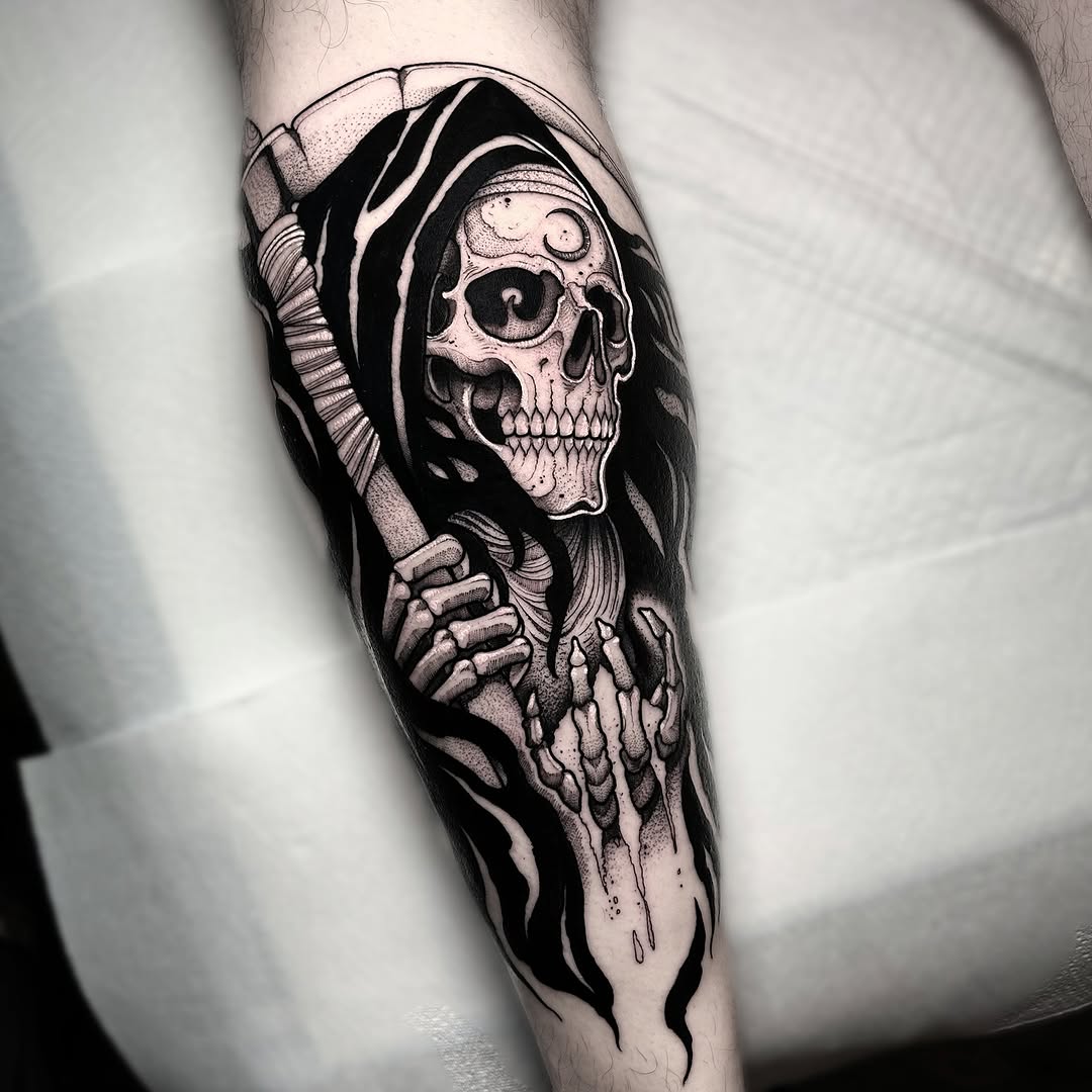 Grim reaper skull wearing a hooded robe with skeletal hands visible, tattooed on the forearm in black ink with shading and dot work details.