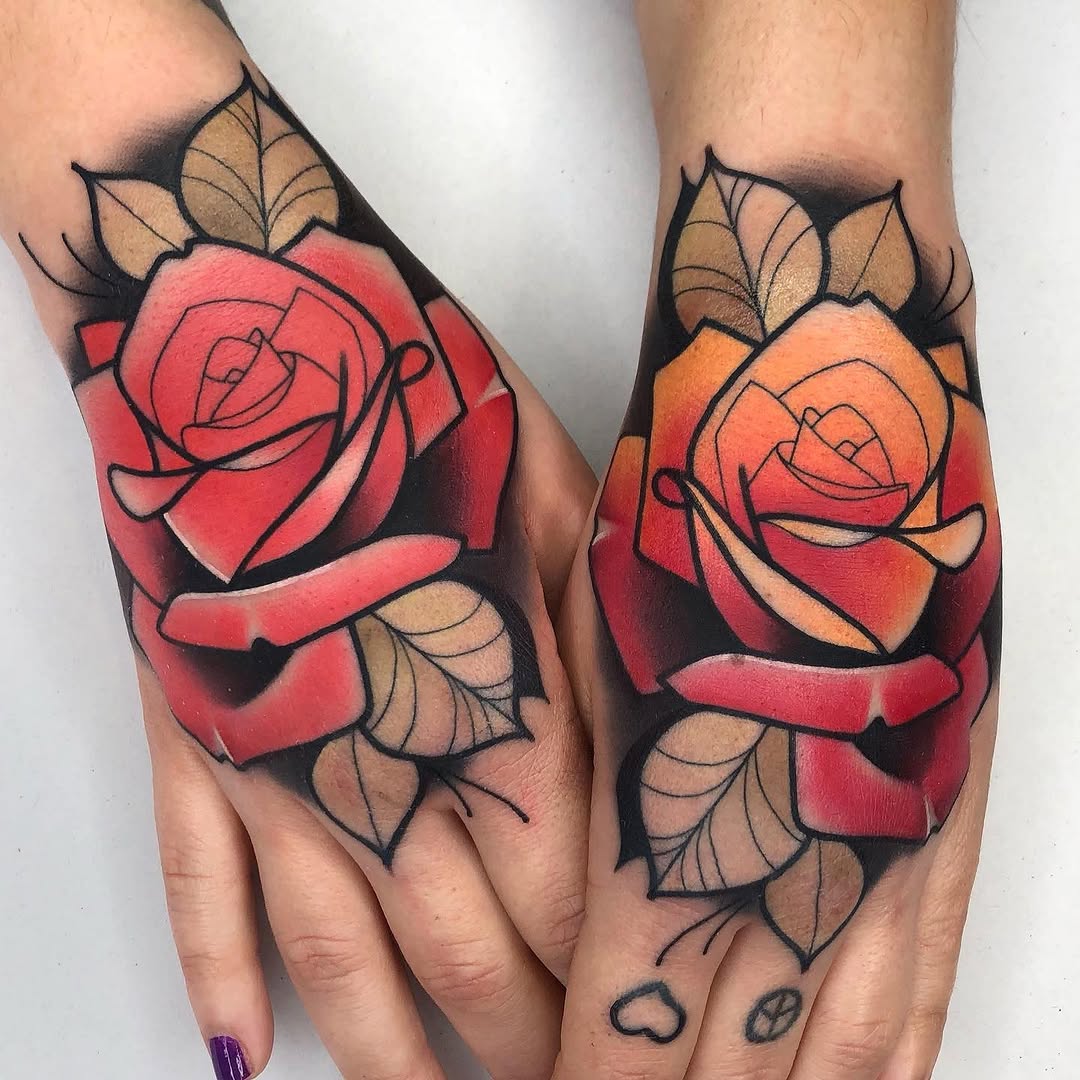Two matching rose tattoos with green leaves on the backs of hands, featuring red and orange gradient petals with black outlines and shading.