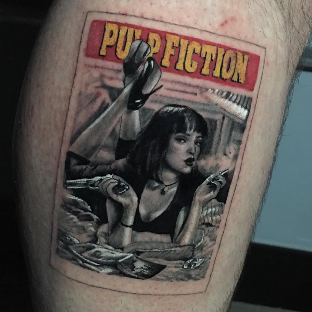 Pulp Fiction movie poster tattoo on leg featuring a woman with raised fist, holding a cigarette and weapon, with red and yellow banner text above.