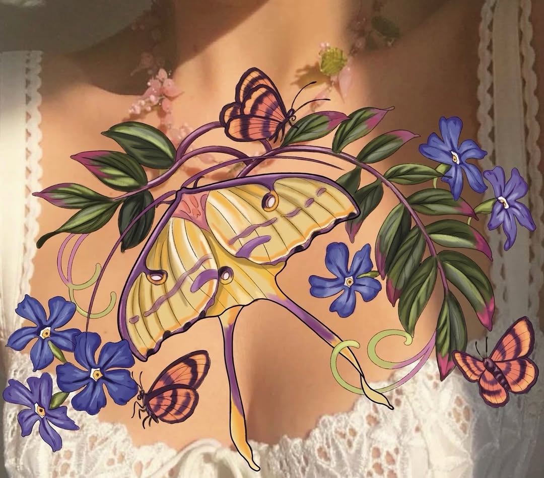 Colorful arm tattoo featuring a large yellow butterfly with purple veins, purple vines with green leaves, blue flowers, and smaller orange butterflies on a peach background.