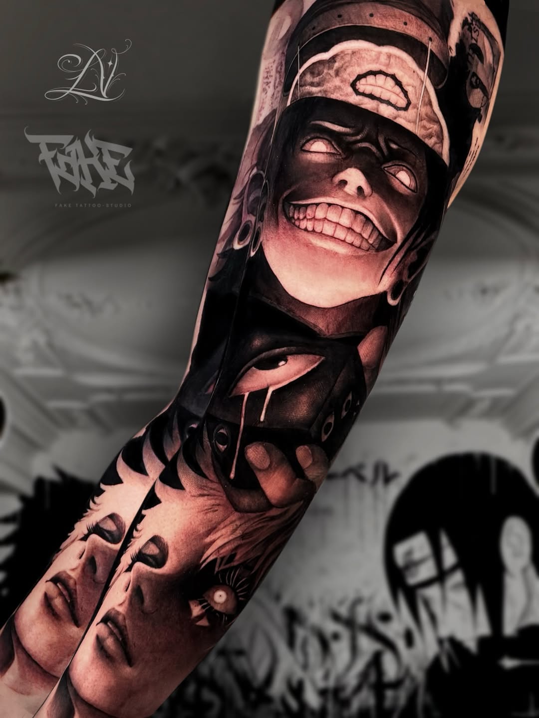 Full-sleeve arm tattoo featuring multiple expressive faces with dramatic facial features and shading in pink and black tones on human skin.
