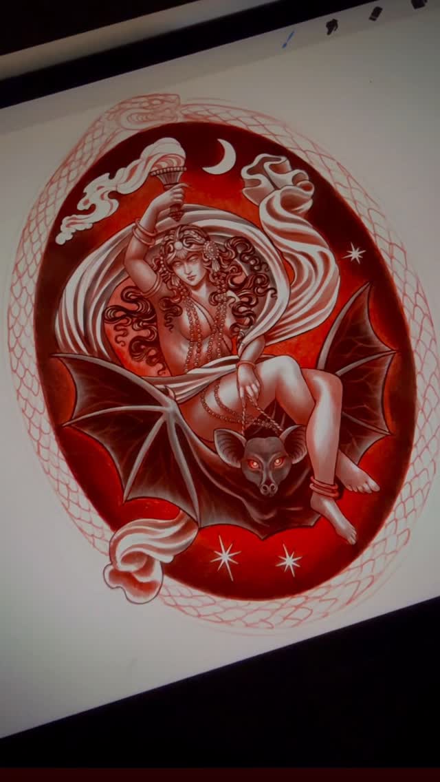 Red and white tattoo design featuring a winged female figure holding a torch above a bat, surrounded by a decorative oval border with crescent moon and stars.