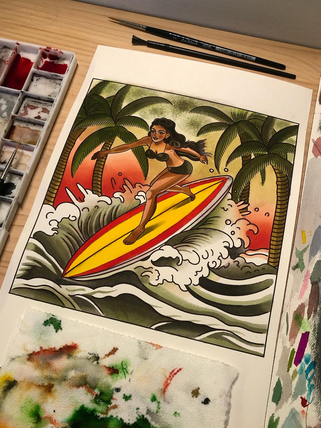 Watercolor painting of a woman surfing a yellow and red surfboard among palm trees and waves with an orange sunset sky.