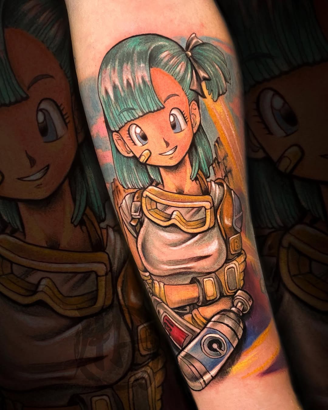 Colorful arm tattoo featuring a smiling anime girl with green hair in an orange and yellow outfit with utility belt and goggles.