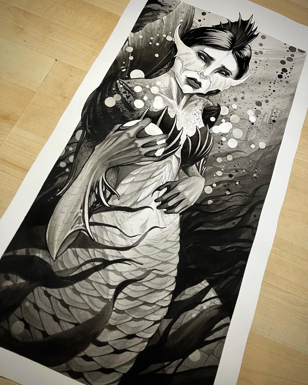 Monochrome portrait print of a woman with styled hair holding flowering plants, featuring detailed linework and dotted accents throughout the composition.