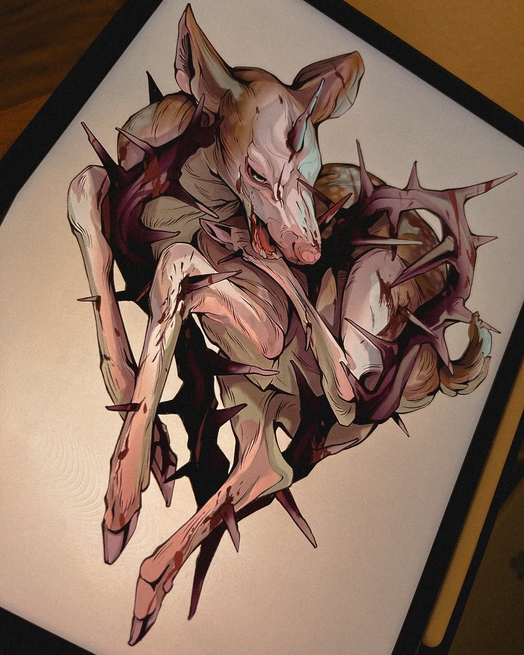 Colored drawing of a skeletal horned creature with spiky protrusions across its body, rendered in pink, burgundy, and tan tones on white paper.