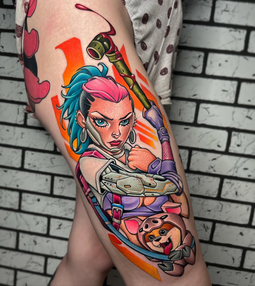 Colorful leg tattoo featuring a blue-haired woman with a weapon, a cartoon bear character, and vibrant orange background elements.