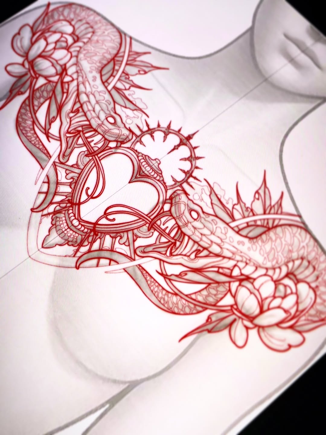 Red ornamental mandala and floral design tattoo on upper arm and shoulder, featuring intricate patterns and blooming flowers in detailed linework.