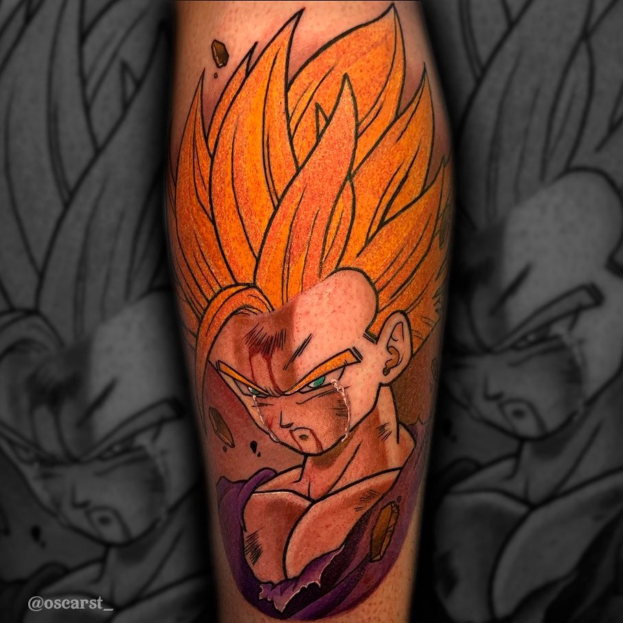 Colored tattoo on the calf of an angry character with spiky orange hair, facial markings, and purple clothing against a background of gray foliage.