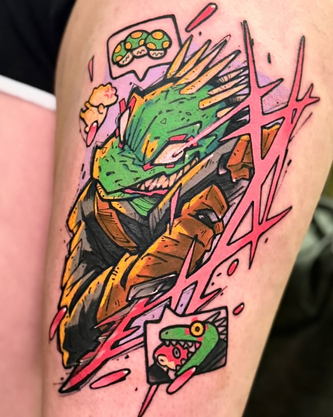 Colorful tattoo on an arm featuring a green dragon head with yellow accents, surrounded by pink lightning bolts and small creature designs on a pink background.