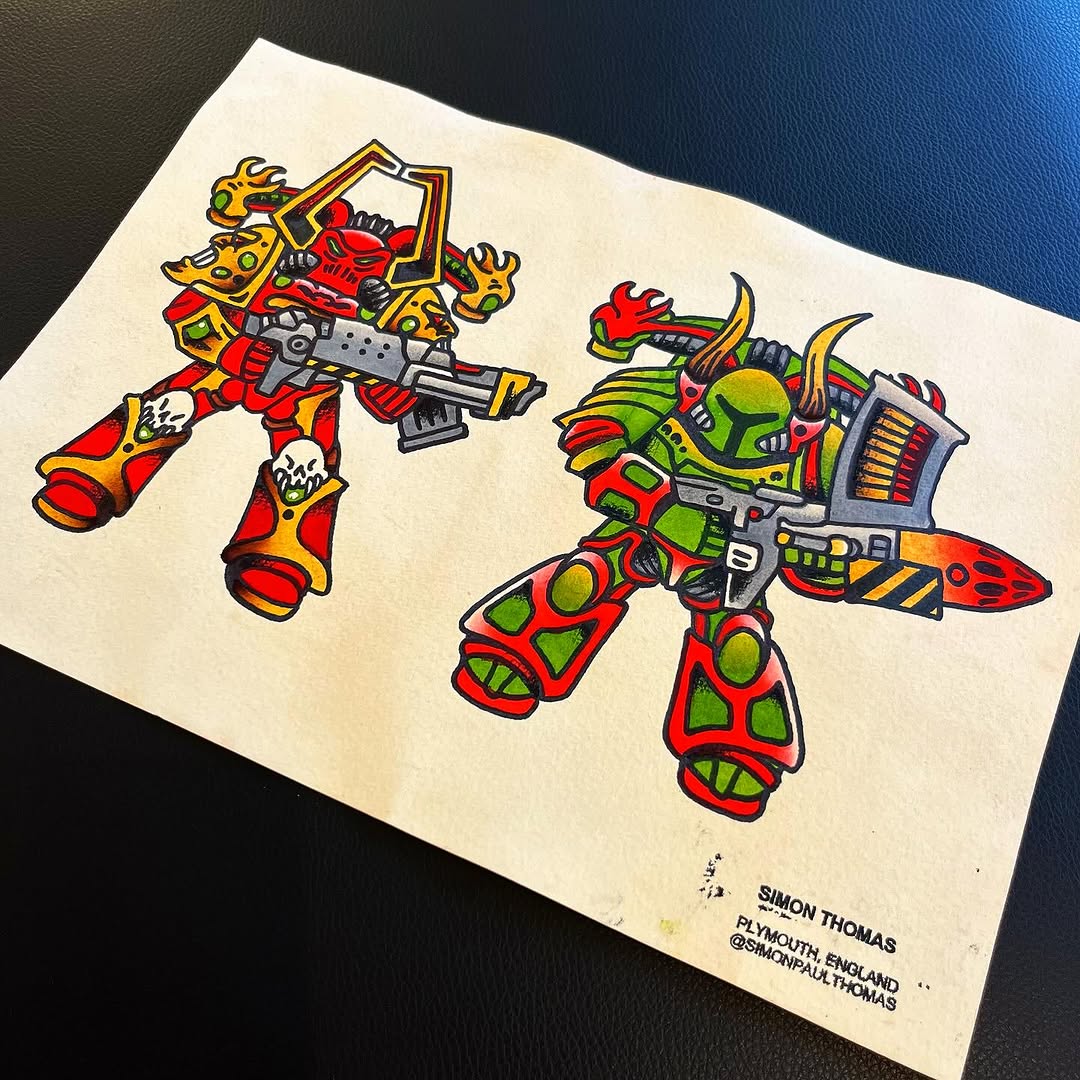 Two colorful mechanical alien robots with red, yellow, and green bodies holding weapons, drawn on cream paper by Simon Thomas.