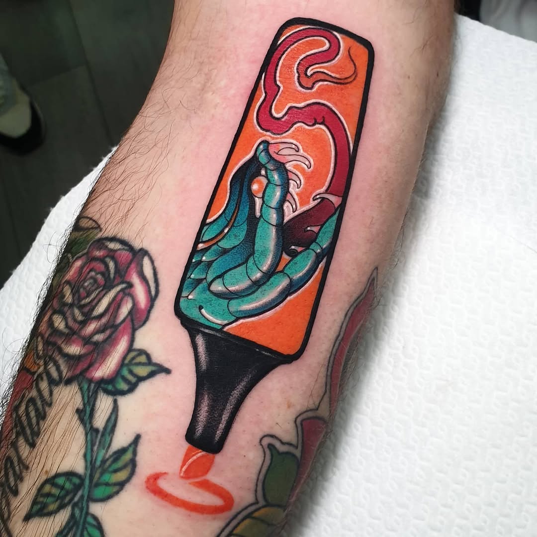 Colorful popsicle tattoo with turquoise and orange gradient on forearm, featuring black outline and red drip detail, displayed among other arm tattoos.