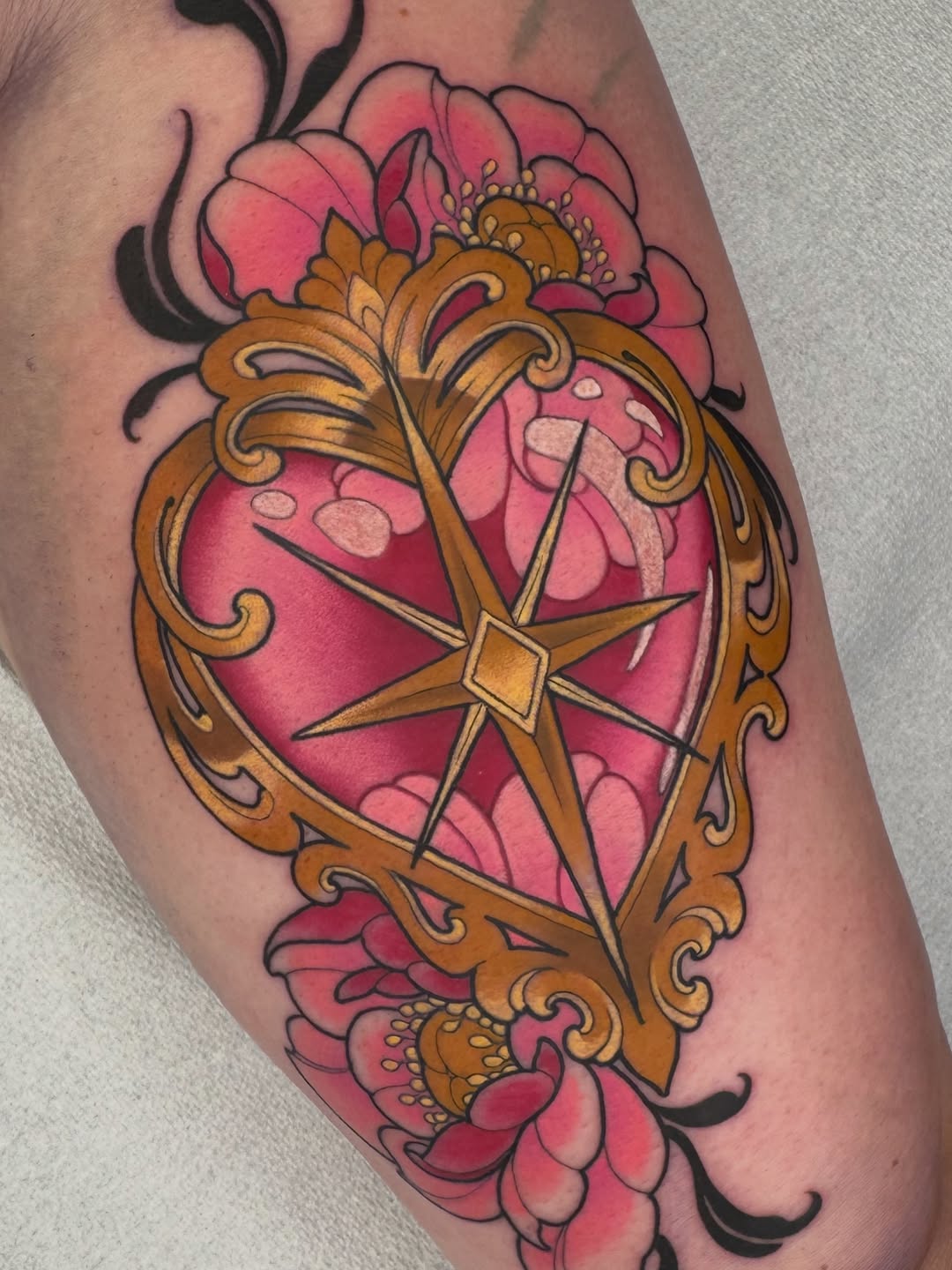 Ornate golden frame with pink peonies and a gold star bow on the upper arm, featuring detailed shading and vibrant color work.