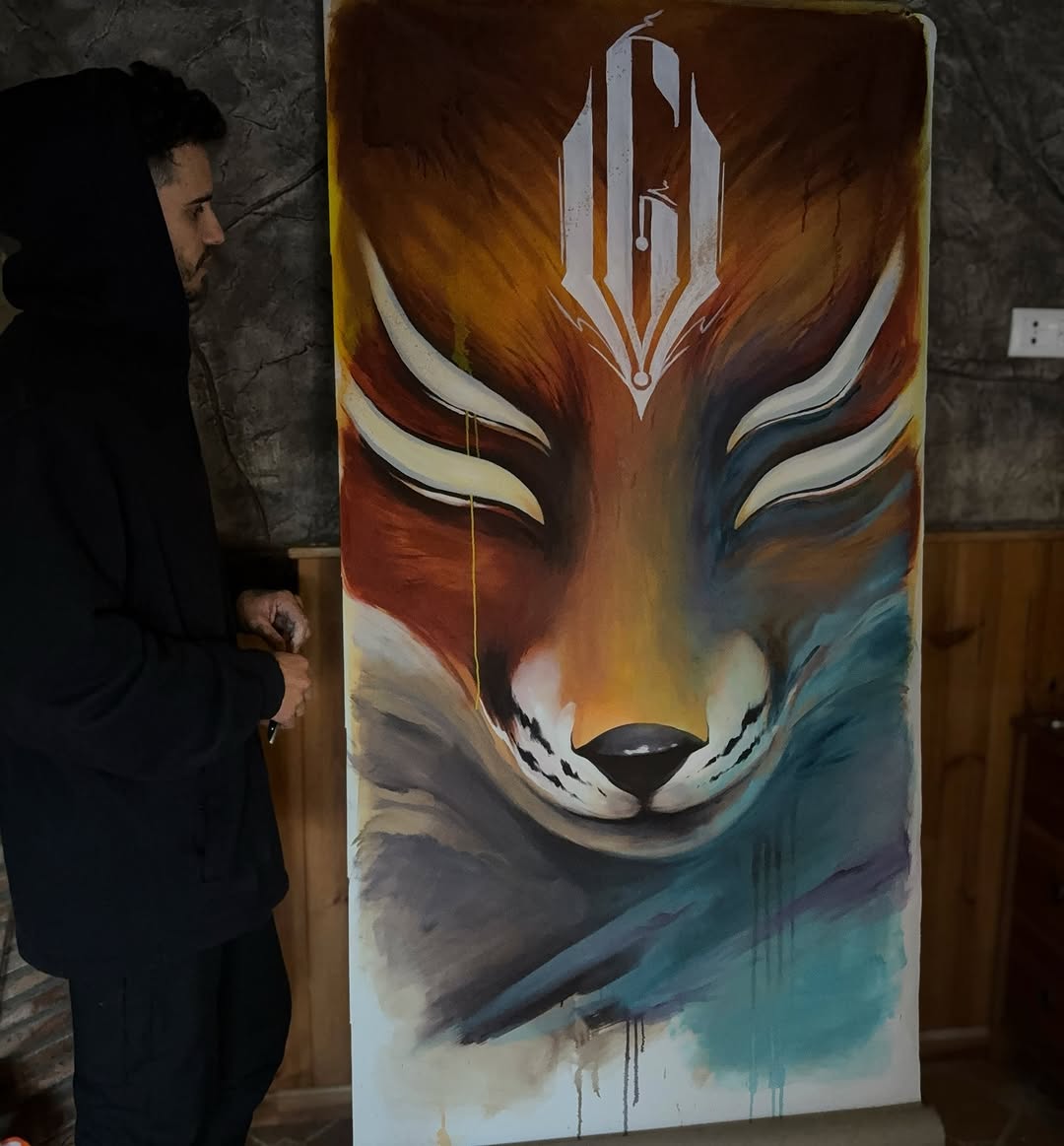 Large vertical fox head tattoo design featuring warm orange and cool blue gradient tones with white facial markings and a geometric symbol above.