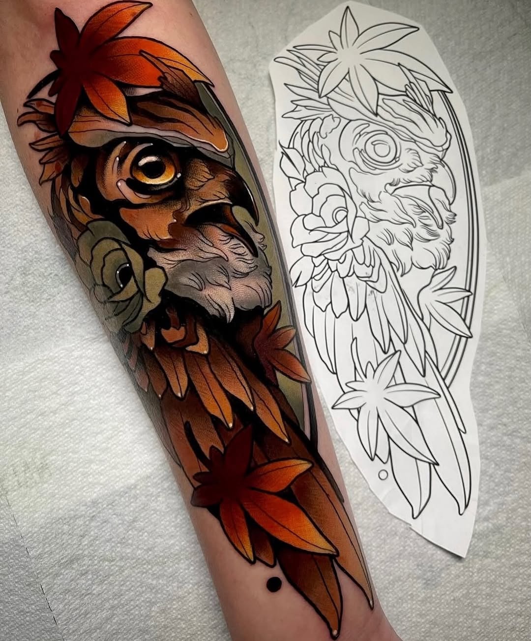 Colored owl tattoo on forearm featuring orange and red plumage, golden eyes, and decorative flowers, displayed alongside a line-drawing design template.