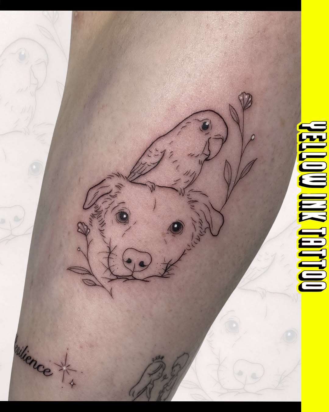 Dog with a small bird perched on its head, surrounded by botanical elements, tattooed on the upper leg in black ink.